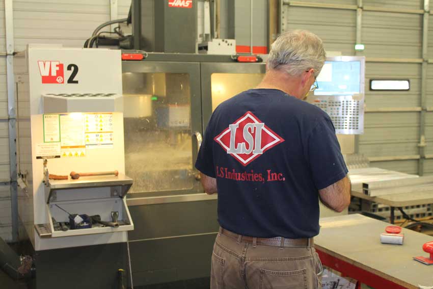 An employee working on an LS Industries project.