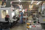 Employees working with Haas equipment
