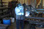 Welder fabricating a project for a customer.